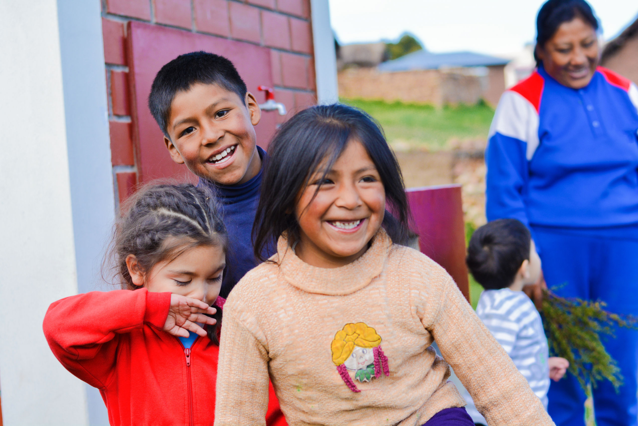 Photo of a group of children smiling.